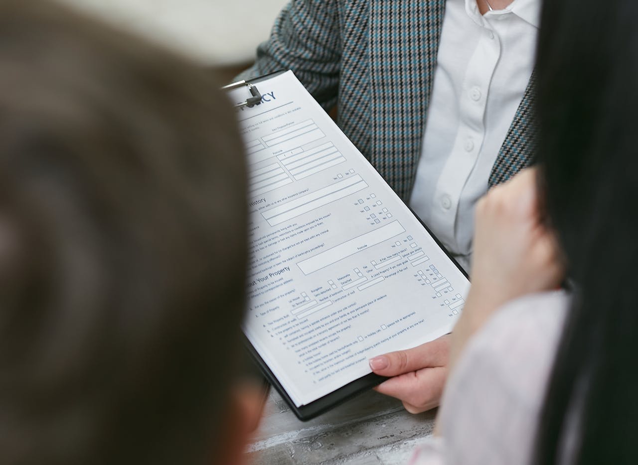 services-02 Close-up of professionals discussing a legal contract during a business meeting.